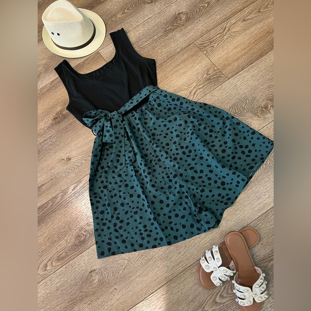 Romper - black top half with green cheetah print bottom half with belt strap